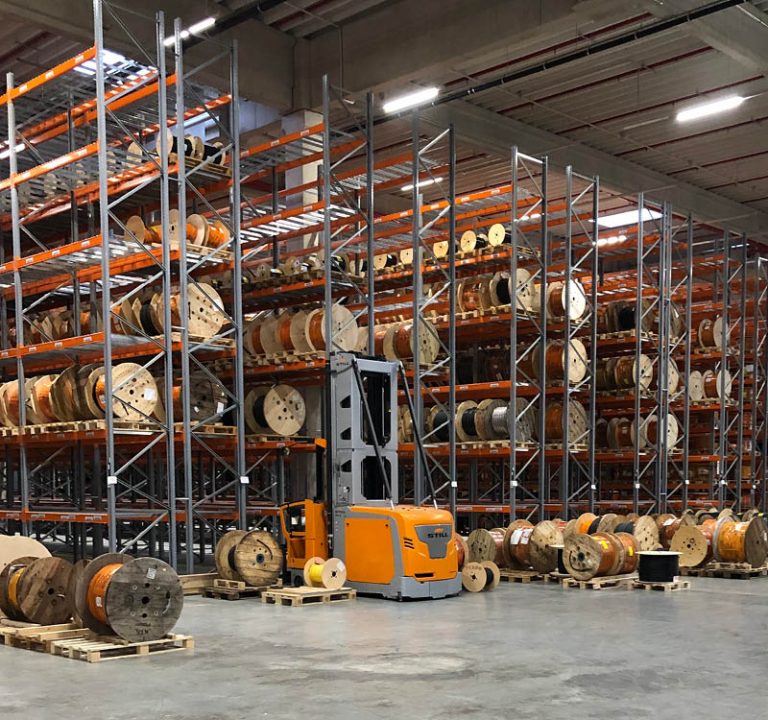 You can see shelves with cable drums in the logistics center in Hanover