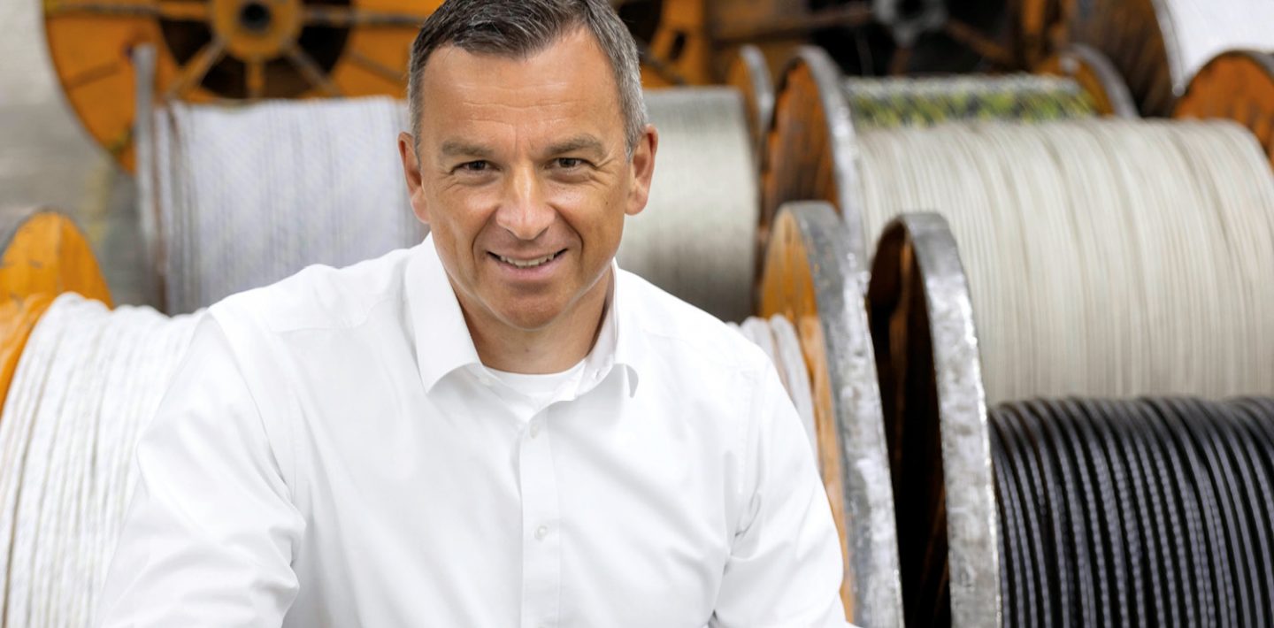 The picture shows Chief Operating Officer LAPP LA EMEA Boris Katic in front of cable drums.