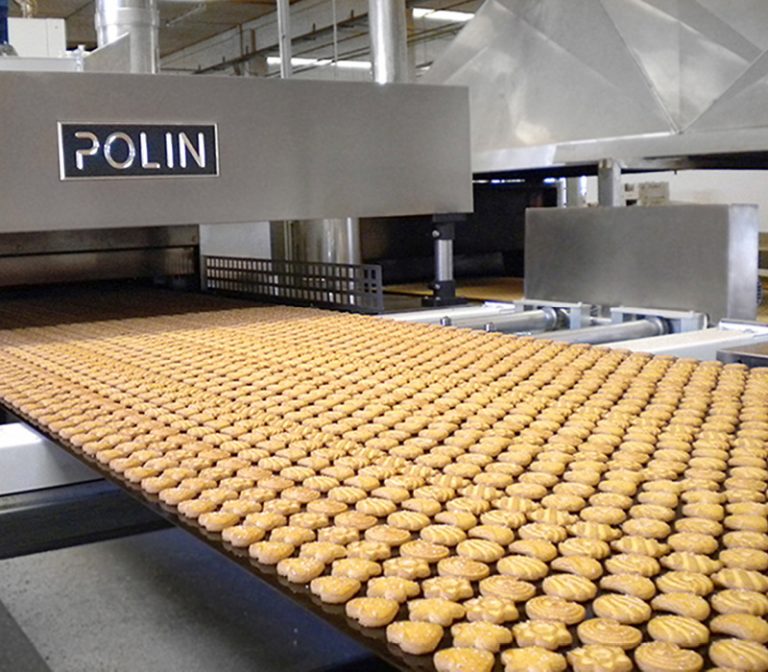 The picture shows an assembly line covered with biscuits in biscuit production.