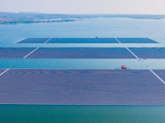 The picture shows three large arrays of solar cells floating in the water.